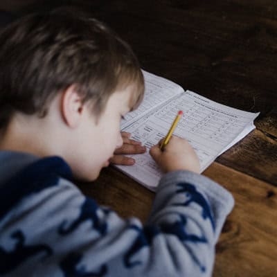 Young boy doing homework at home